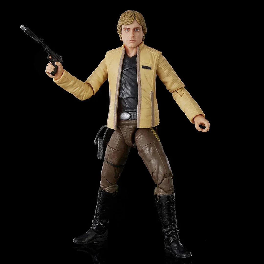 Collectible action figure in yellow jacket and brown pants holding toy blaster on black background
