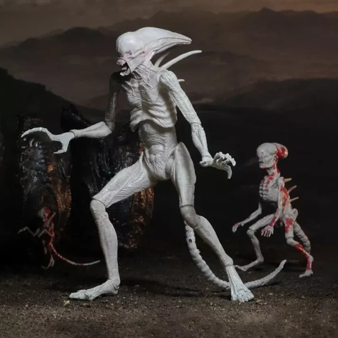 Alien creature action figures with detailed sculpting and monster design on a dark background