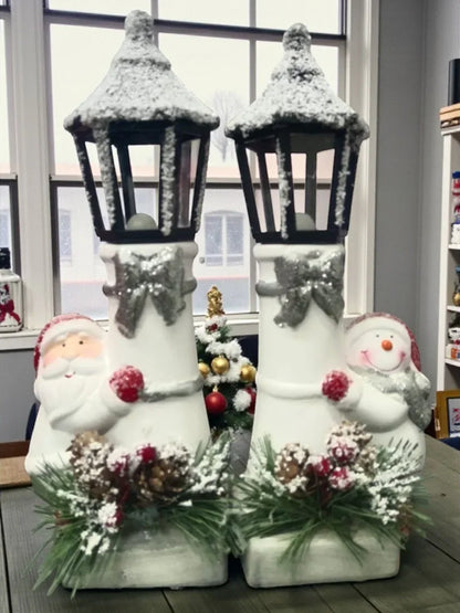 Snow Lantern Christmas Figurine Set | Santa & Snowman with Pinecones & Snowy Greens – Festive Table Décor Pack of 2