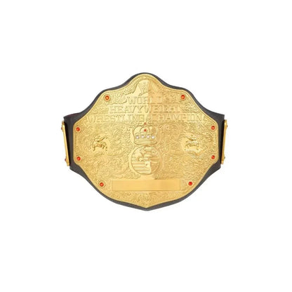 Gold world heavyweight wrestling champion belt with ornate engravings on white background