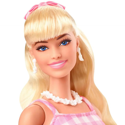 Barbie™ The Movie Doll Wearing Pink and White Gingham Dress with Daisy Chain Necklace - Jaiman Toys