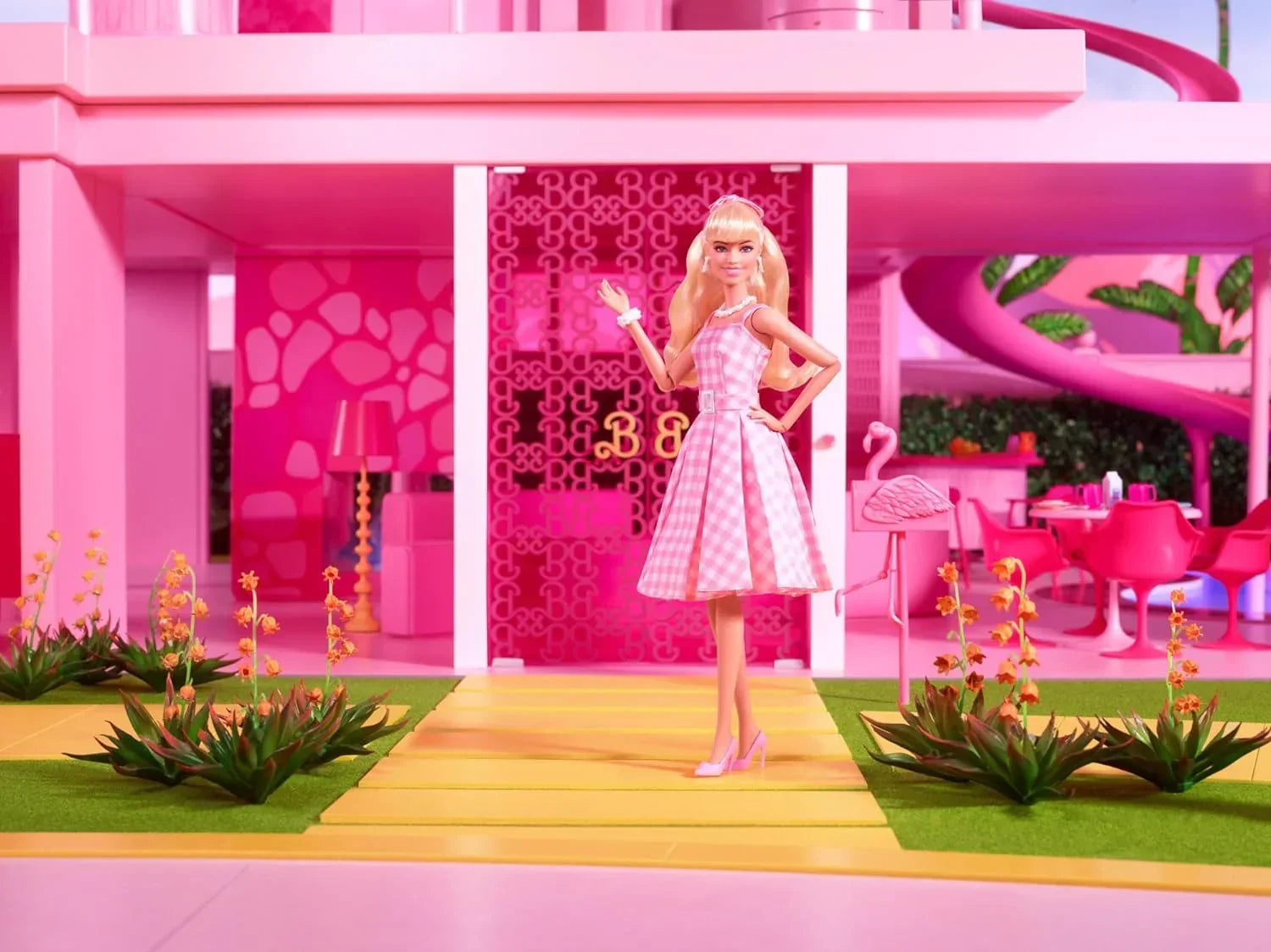 Barbie™ The Movie Doll Wearing Pink and White Gingham Dress with Daisy Chain Necklace - Jaiman Toys