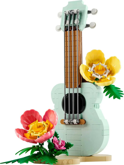 LEGO guitar model decorated with colorful brick-built flowers on a white background