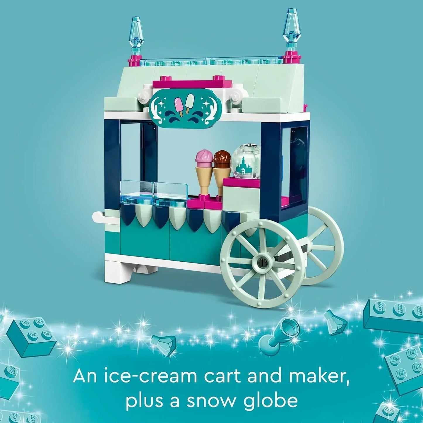 LEGO ice cream cart toy set with cones, snow globe, decorative sign, and blue wheels