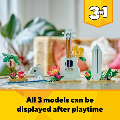 LEGO Creator 3-in-1 set with dolphin, guitar, and surfboard toy models on display table.