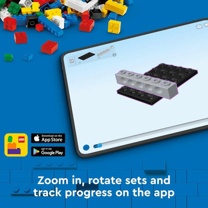 Colorful LEGO bricks scattered beside a tablet displaying digital LEGO building instructions.