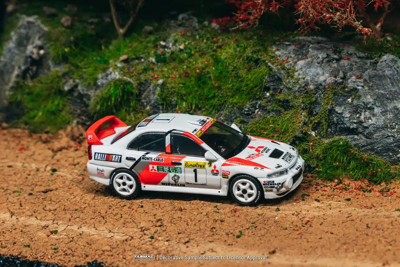 Tarmac Works GLOBAL64 1:64 Mitsubishi Lancer Evolution IV Rallye Monte-Carlo 1997 Diecast Model Car (T64G-076-97MCR01)