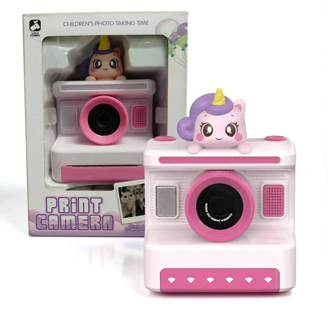 Pink toy camera with unicorn design and packaging on a white background