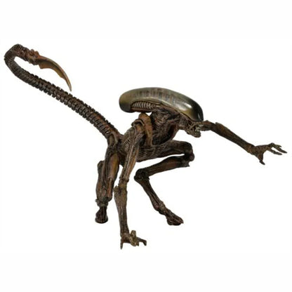 Collectible alien creature action figure with long tail and detailed body on white background