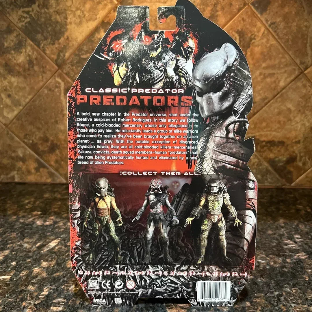 Back of Predator action figure packaging showing three Predator figures, movie-themed design, and description text.