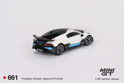 White and blue collectible toy sports car model MINI GT on plain background