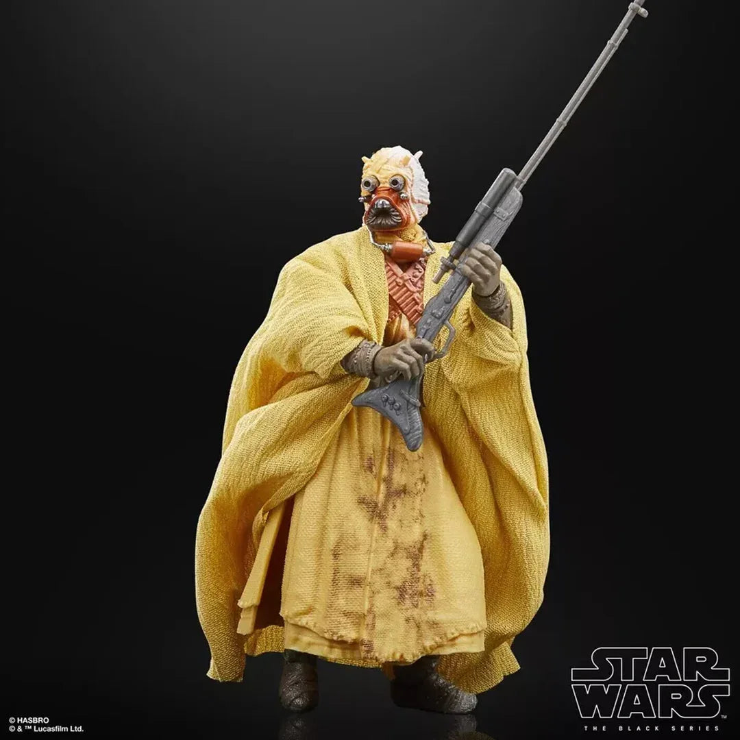 Star Wars Tusken Raider action figure in yellow robe holding a rifle on black background