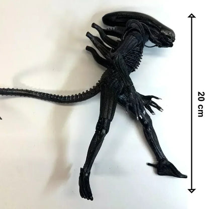 Black alien action figure, 20 cm tall, with detailed body, claws, and long tail on white background
