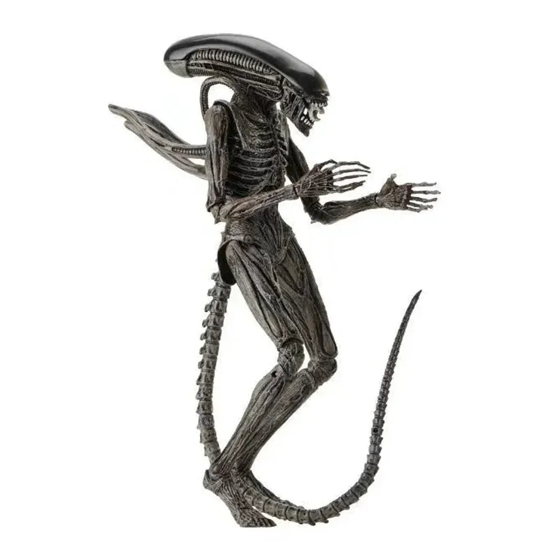 Alien action figure collectible toy with elongated head and detailed black body, isolated on white