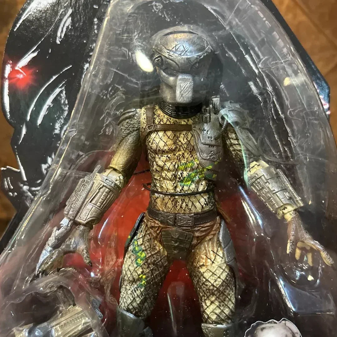 Predator action figure in detailed armor and helmet, collectible toy in packaging