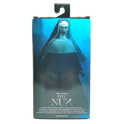 The Nun horror movie action figure box with eerie nun illustration and blue background