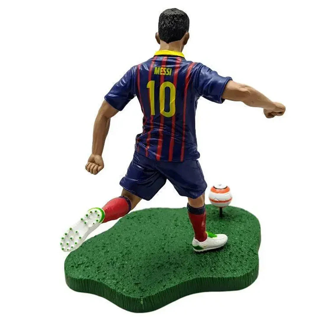 Soccer player collectible action figure in blue and red striped uniform taking a shot with ball