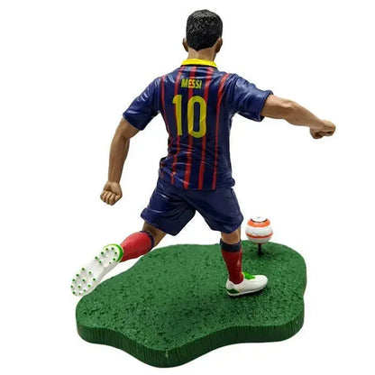 Soccer player collectible action figure in blue and red striped uniform taking a shot with ball
