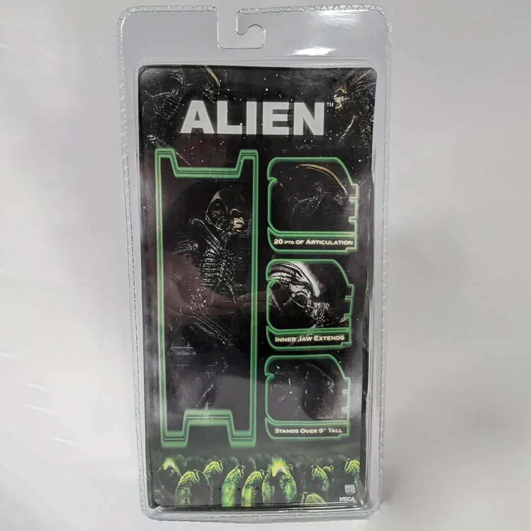 NECA Alien action figure toy packaging, features articulated black alien collectible figure.