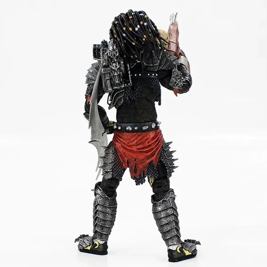 Armored action figure with dreadlocks, red loincloth, and detailed weapon accessories