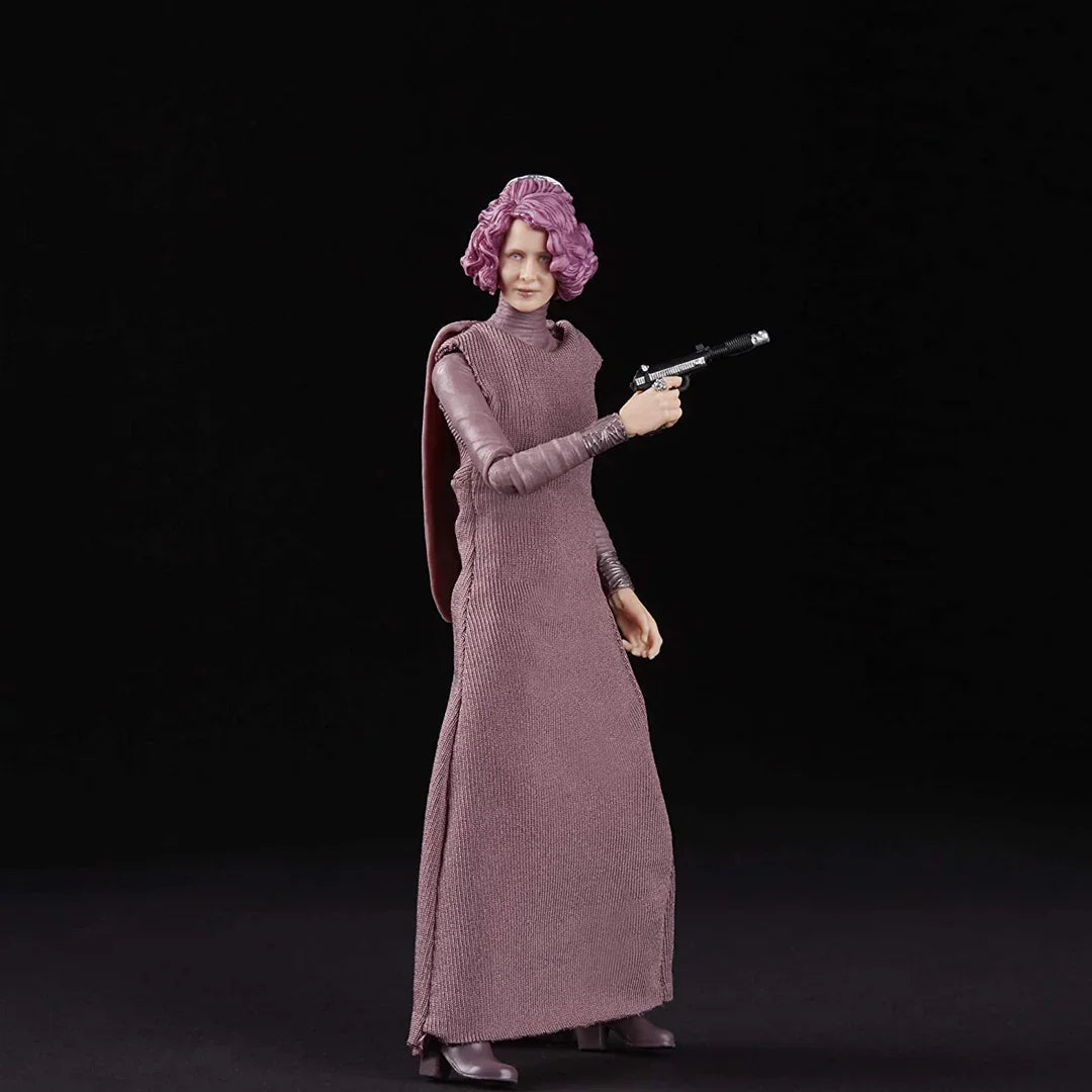 Action figure with purple hair and long dress holding a blaster, collectible toy