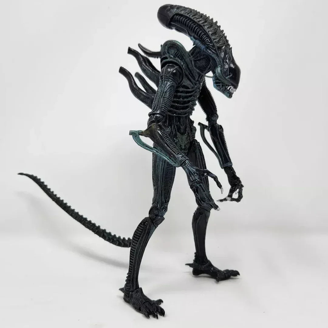 Detailed alien action figure collectible toy with elongated head and tail on white background