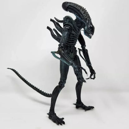 Detailed alien action figure collectible toy with elongated head and tail on white background
