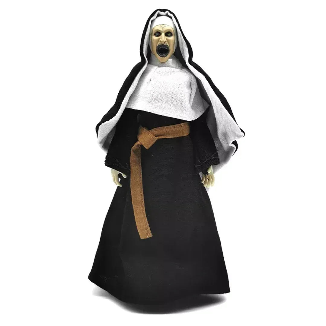 Scary nun action figure in black and white habit with open mouth and dramatic expression.