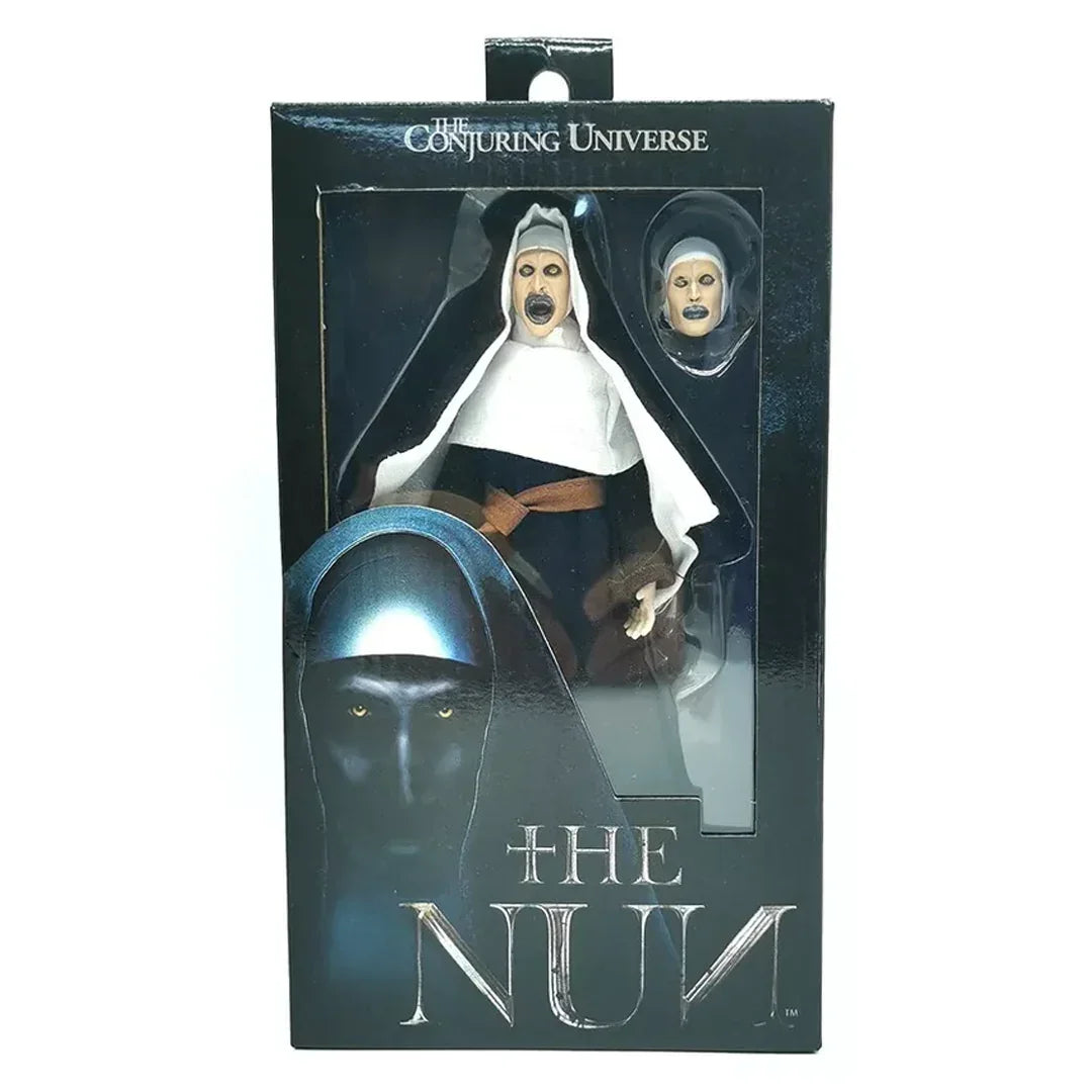 The Nun horror action figure collectible in box with alternate head, from The Conjuring Universe