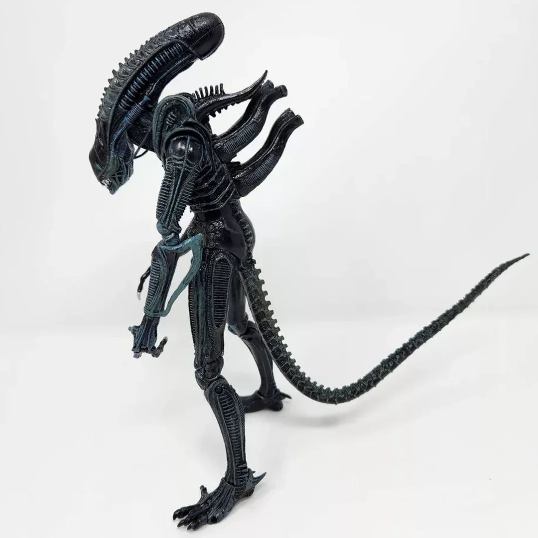 Alien action figure collectible with detailed black exoskeleton and long tail on white background