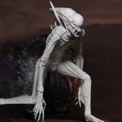 Alien action figure collectible toy with elongated head and sharp claws in dynamic pose