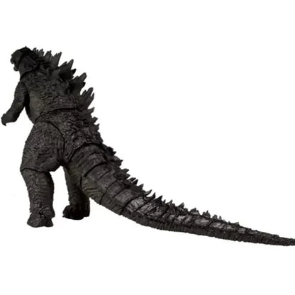 Black Godzilla action figure toy with textured scales and long tail on white background