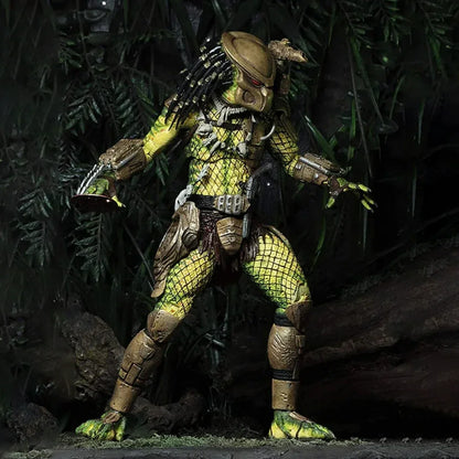 Detailed action figure of armored alien creature posed in jungle setting with realistic foliage.