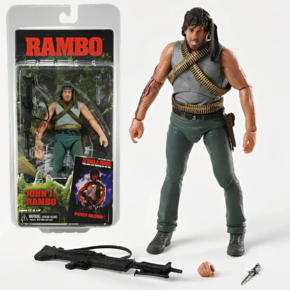 Rambo John J. action figure with weapons, extra hand, and original packaging displayed