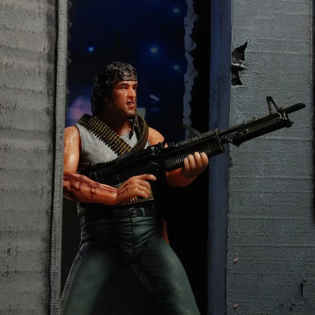 Action figure with headband and toy rifle in an urban setting, collectible toy for kids