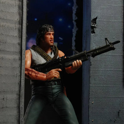 Action figure with headband and toy rifle in an urban setting, collectible toy for kids
