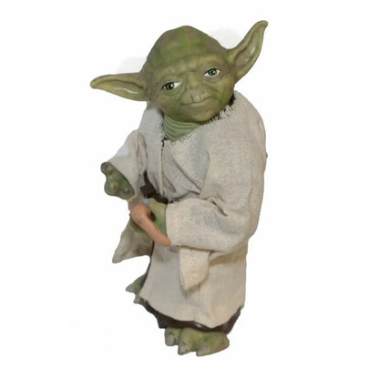 Yoda action figure collectible toy in robe holding a cane, isolated on white background