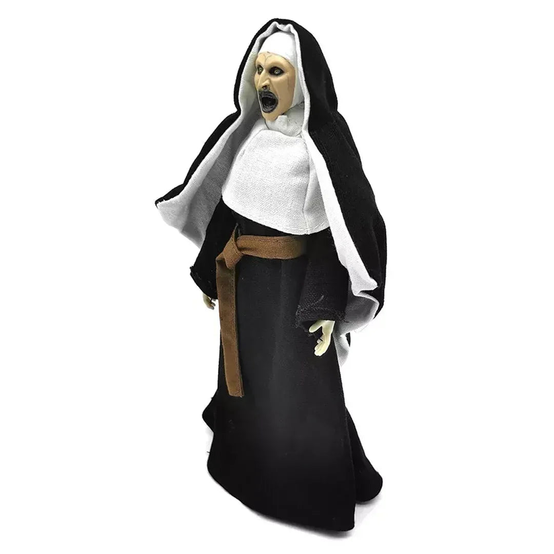 Horror nun action figure with black hood, white habit, and open mouth, collectible toy