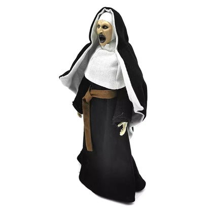 Horror nun action figure with black hood, white habit, and open mouth, collectible toy