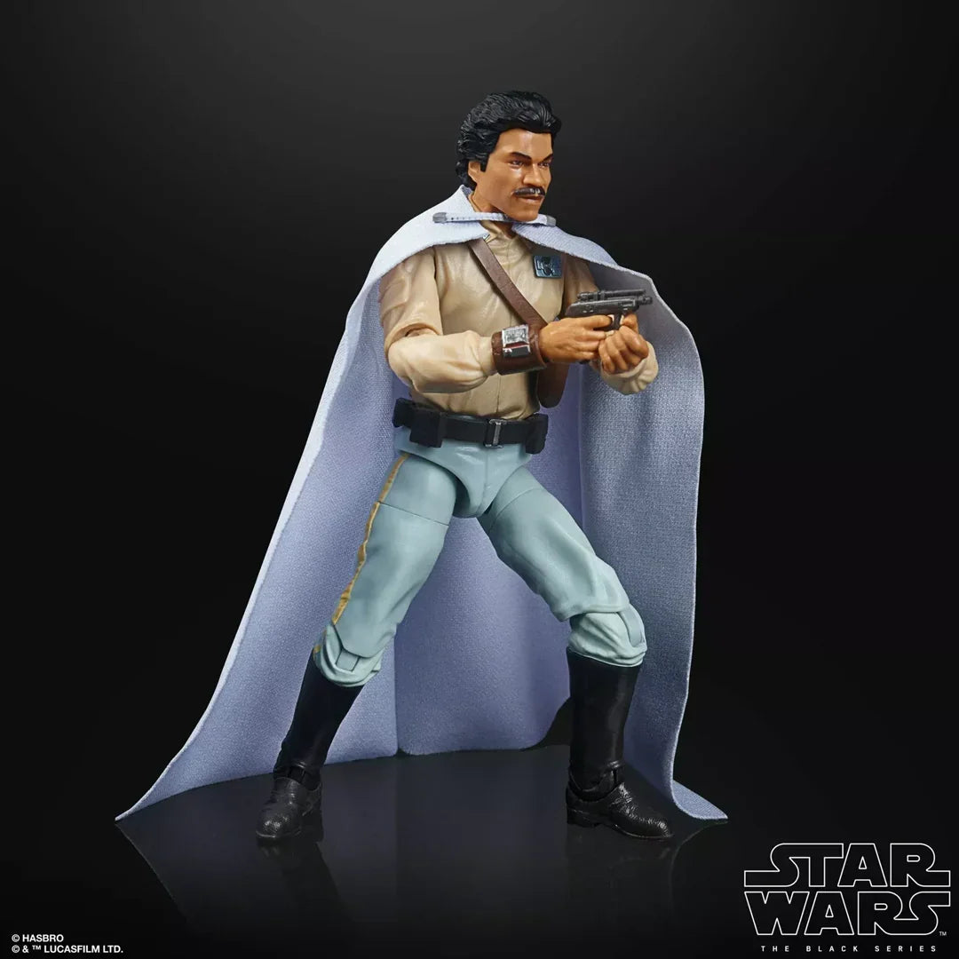 Star Wars action figure wearing a beige shirt, blue pants, white cape, holding a blaster.