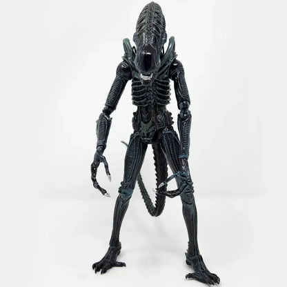 Detailed black alien action figure collectible toy with elongated head and ribbed body on white background