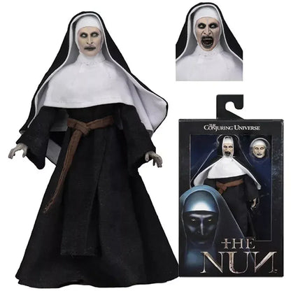 The Nun horror movie collectible action figure with alternate head and retail packaging