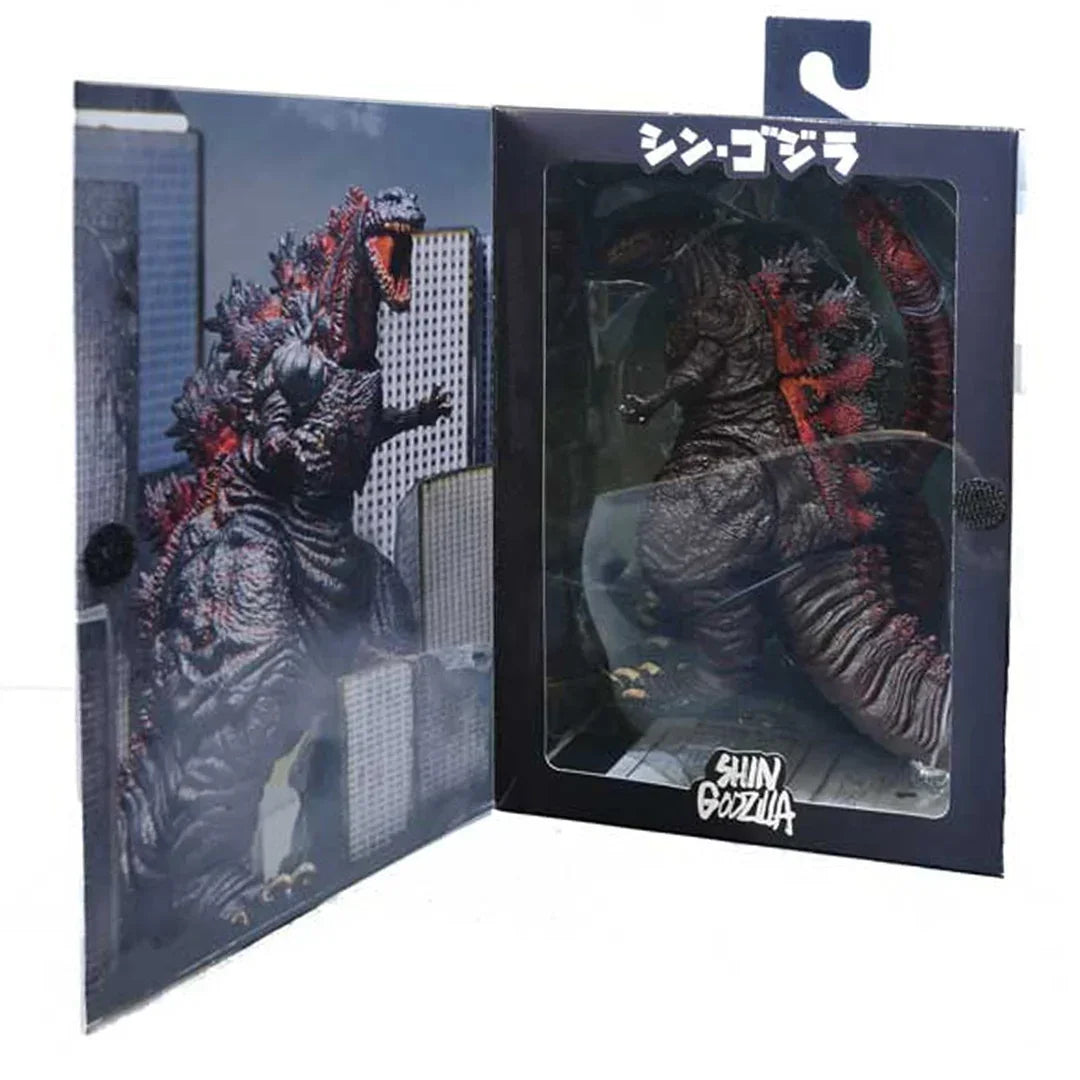 Shin Godzilla action figure in display box with cityscape artwork, collectible monster toy