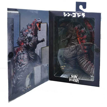 Shin Godzilla action figure in display box with cityscape artwork, collectible monster toy