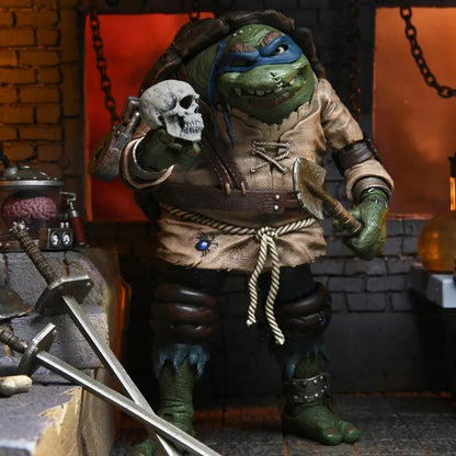 Action figure of masked mutant turtle in medieval costume, holding skull, with swords nearby.