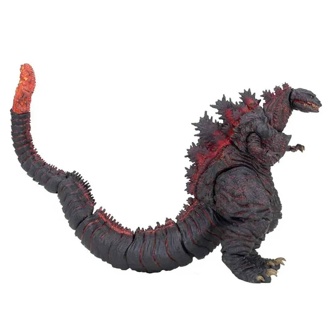 Monster action figure with long tail and glowing red spikes collectible toy.