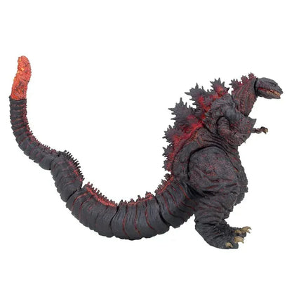 Monster action figure with long tail and glowing red spikes collectible toy.