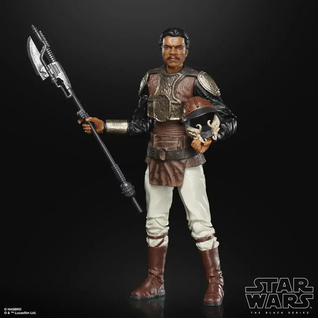 Star Wars action figure in armor holding a helmet and staff, collectible toy on black background