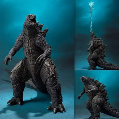 Godzilla action figure collectible toy with blue atomic breath accessory on blue background