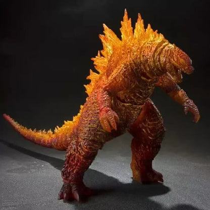 Detailed Godzilla action figure with fiery orange and yellow spikes, collectible toy on display